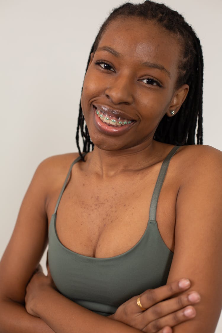 Smiling Black Woman With Braces On Teeth