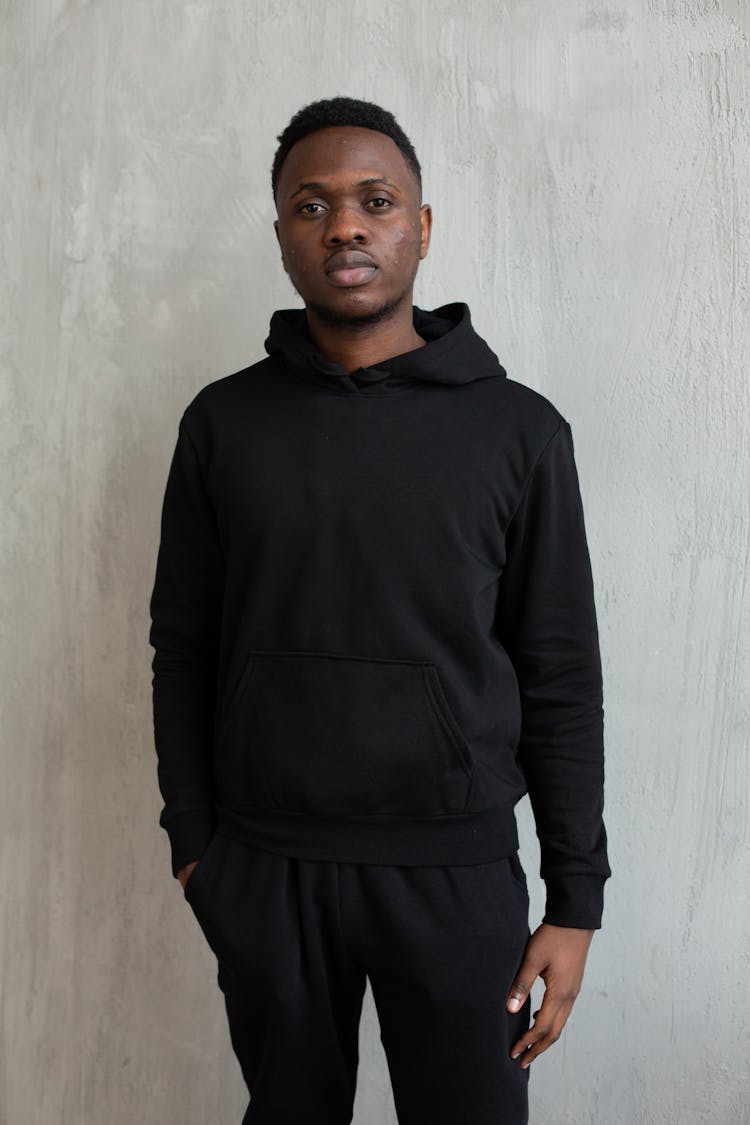 Serious Black Man Wearing Hoodie And Sweatpants