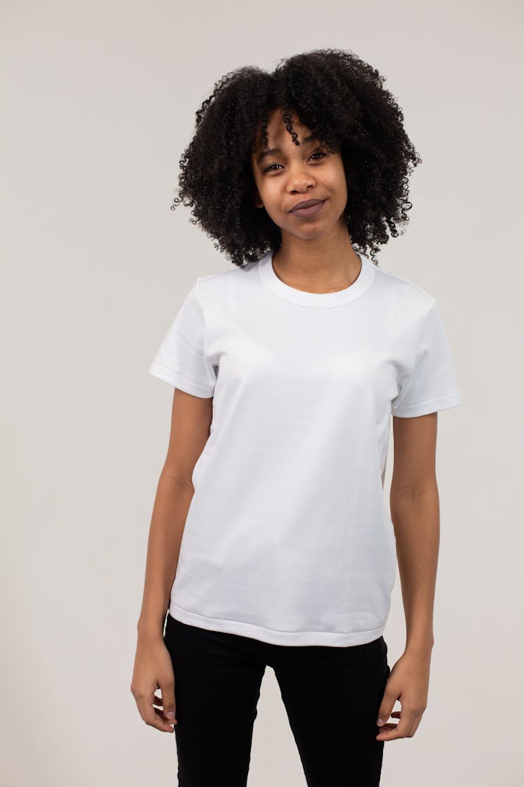 Smiling Black Woman In White T Shirt And Tight Pants