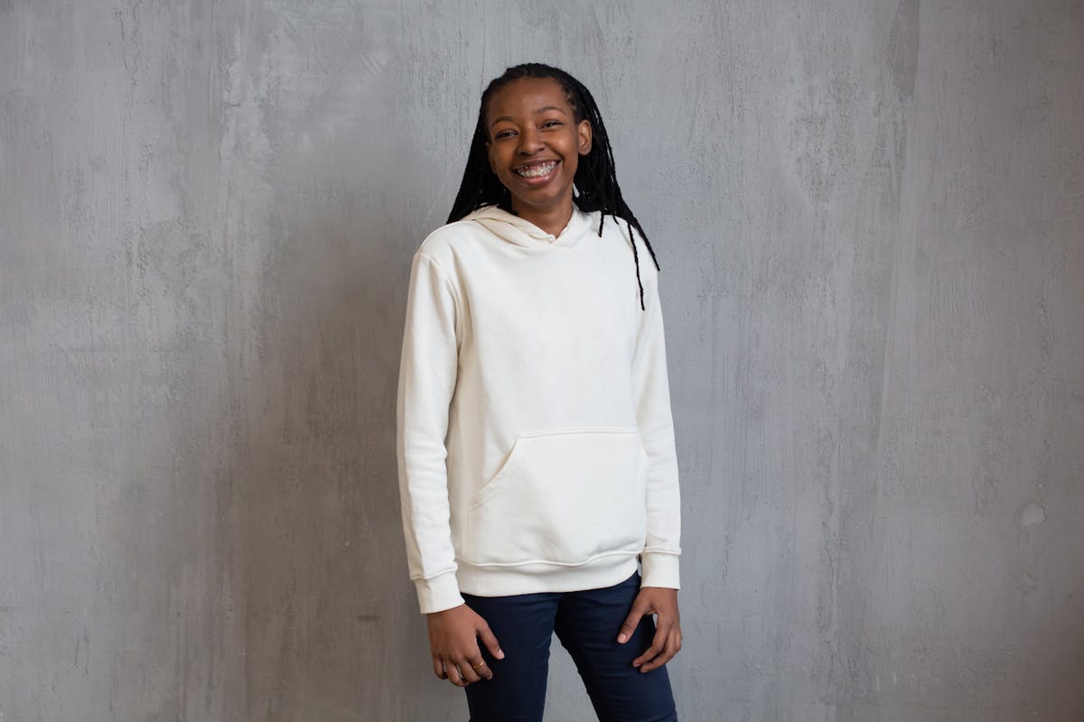 Fashionable woman walking on a city street in a chic, minimalist outfit