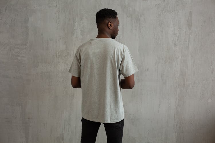 Black Man In T Shirt And Jeans In Studio