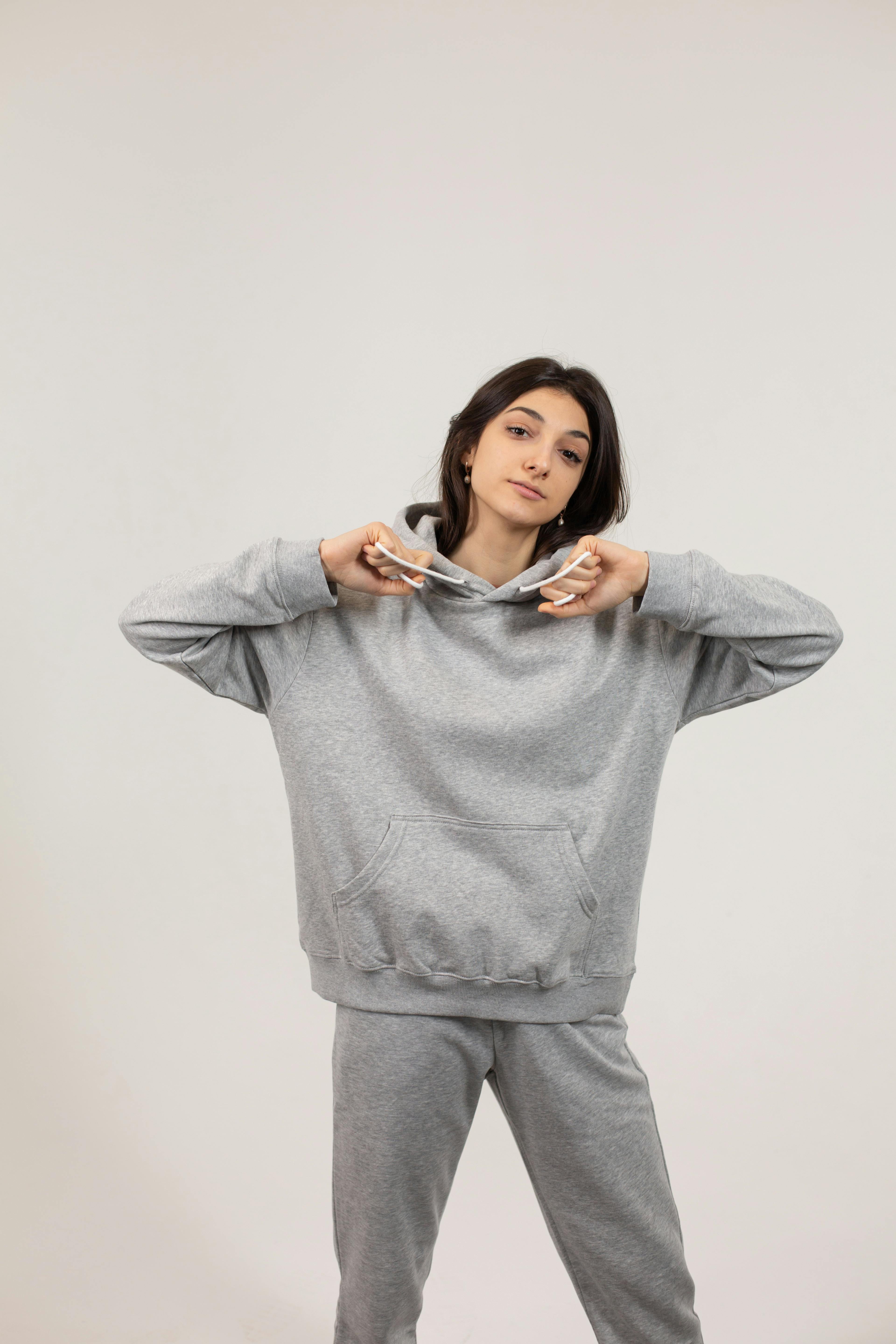 Young woman wearing oversize hoodie and pants · Free Stock Photo