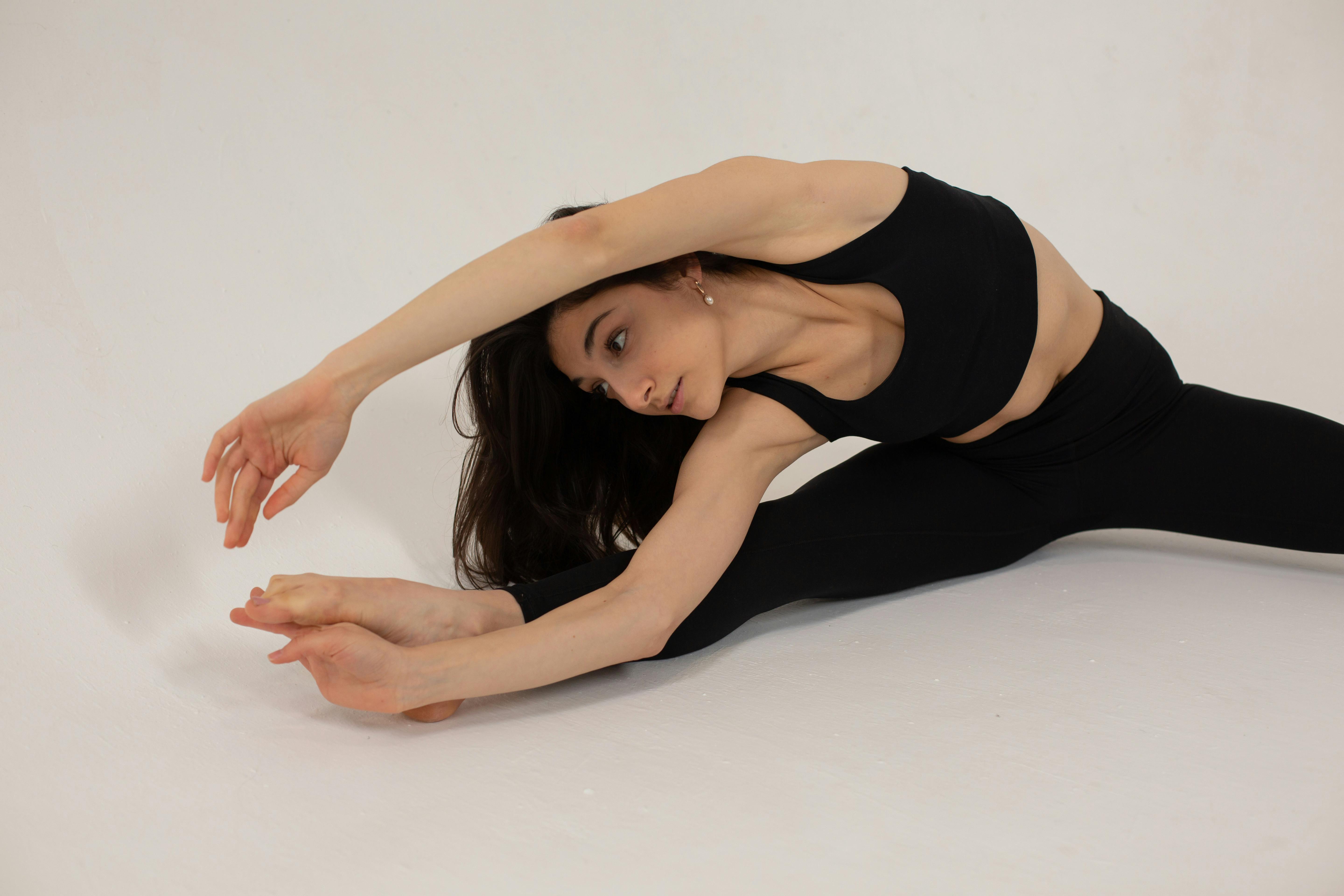 Premium Photo  Woman doing flexible exercise flexion and extension of one  leg