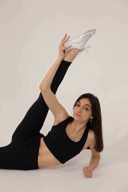 Female athletic stretching stock image. Image of flexibility