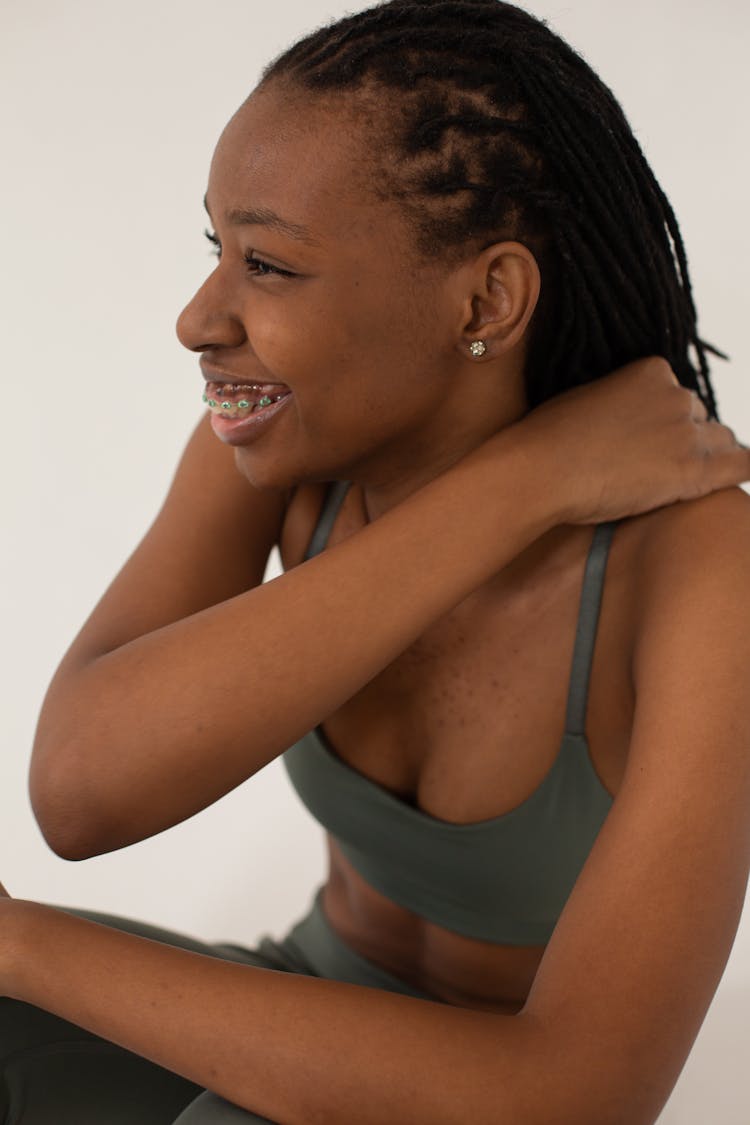 Laughing Black Woman With Dreadlocks Touching Shoulder