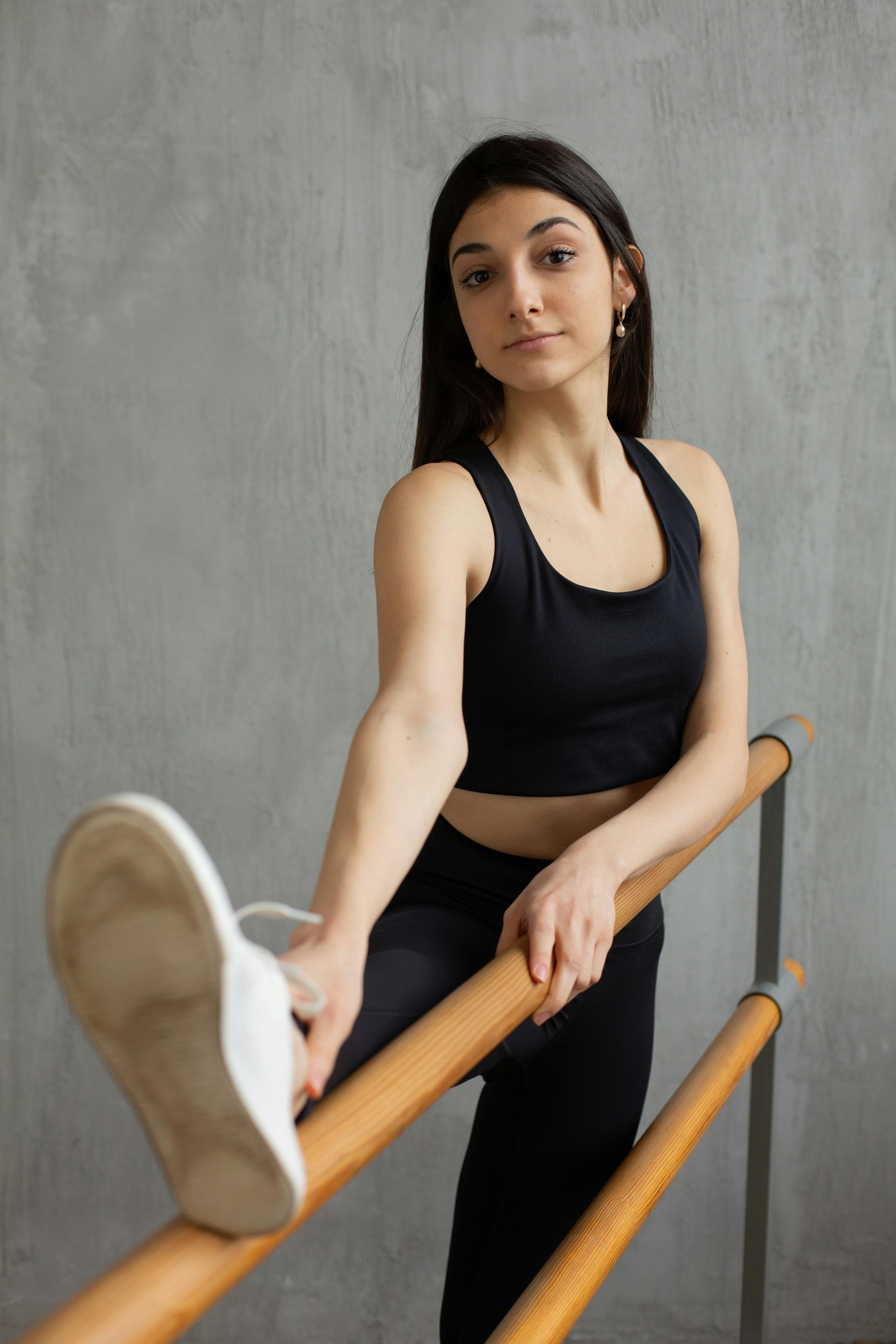 Women Stretching Legs In Fitness Studio Stock Photo, Picture and