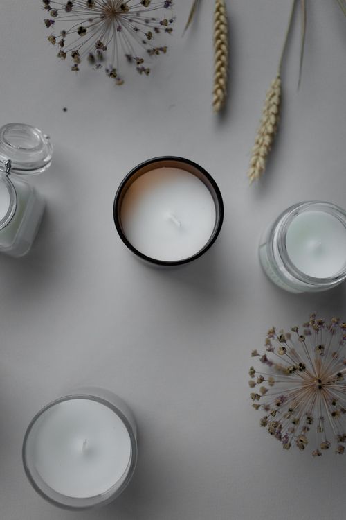 Free Top view of candles and dried wheat on a white background, creating a serene, minimalist aesthetic. Stock Photo