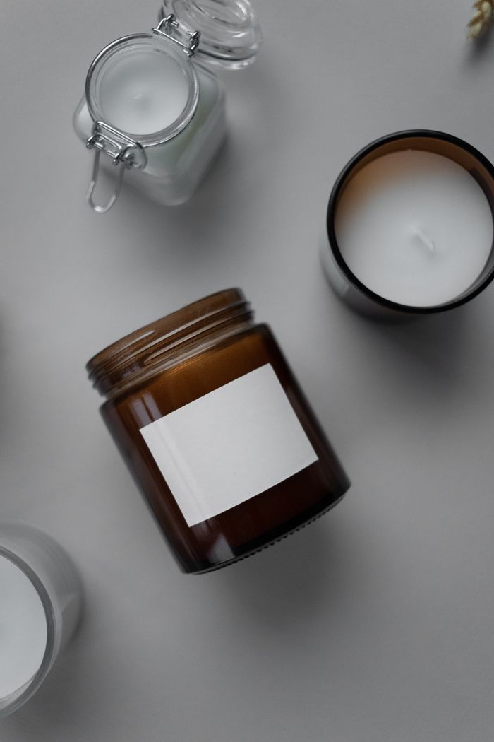 Assorted candles in glass vessels seen from above