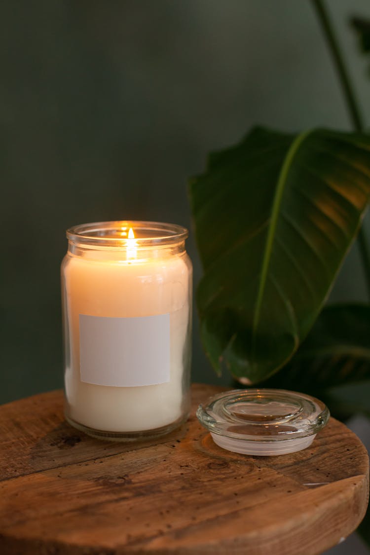 Lighted Candle In A Jar