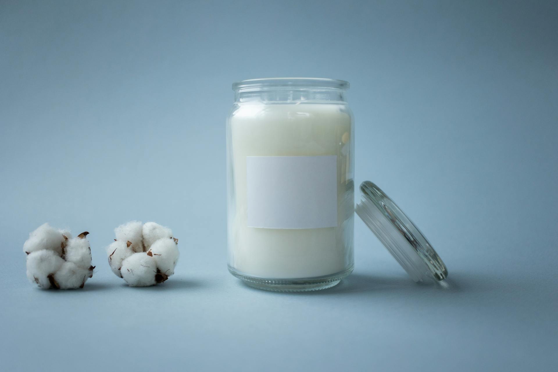 White Liquid in a Clear Glass Jar with Lid
