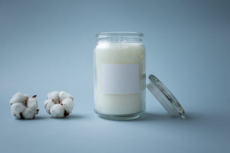 White Liquid In A Clear Glass Jar With Lid 