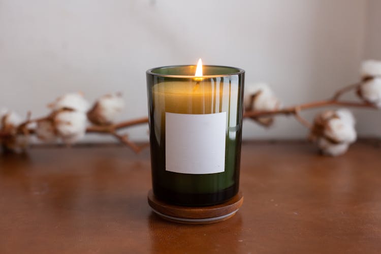 A Burning Candle With Blank Label