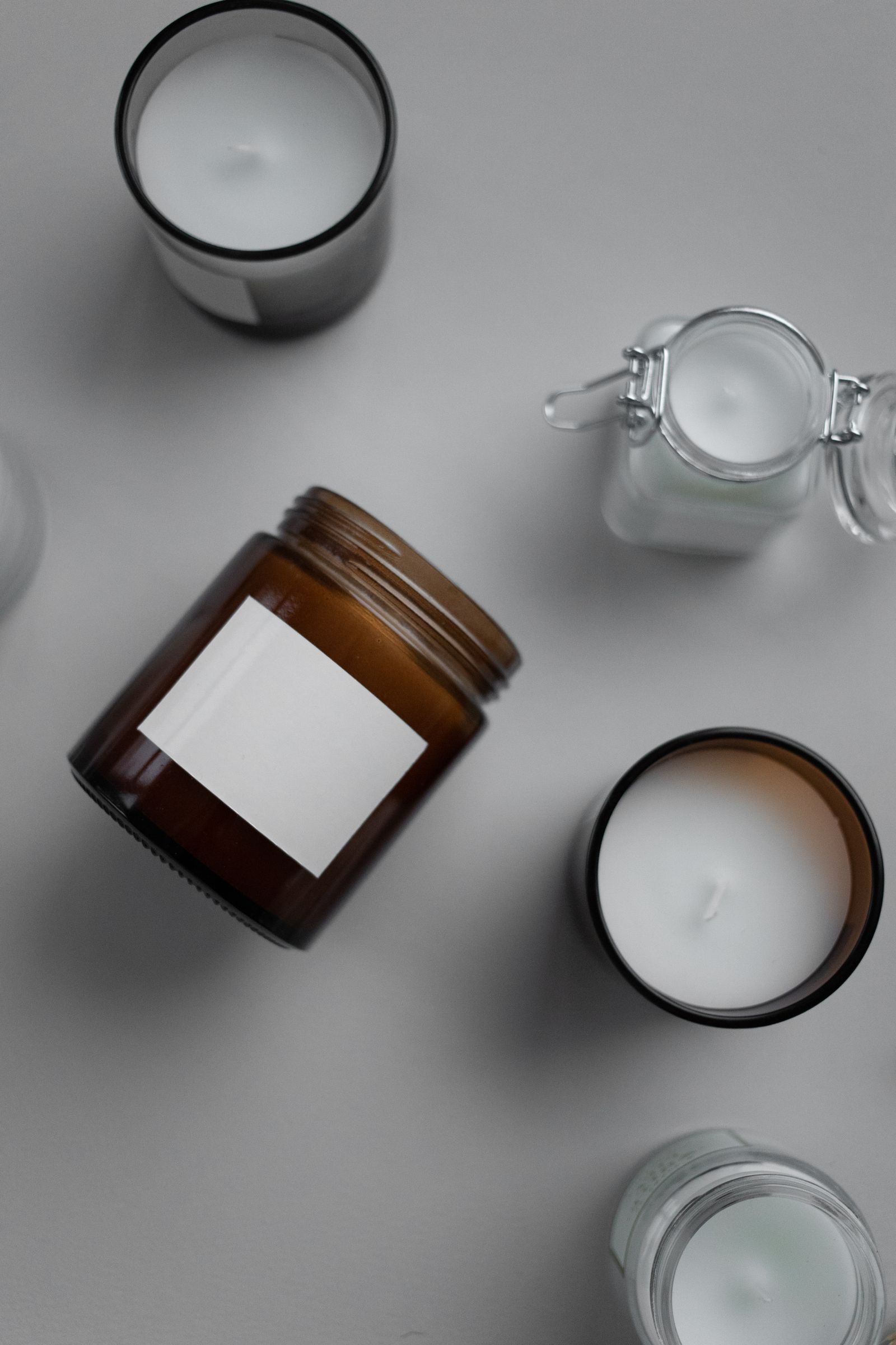 Candle jars flat lay with blank labels
