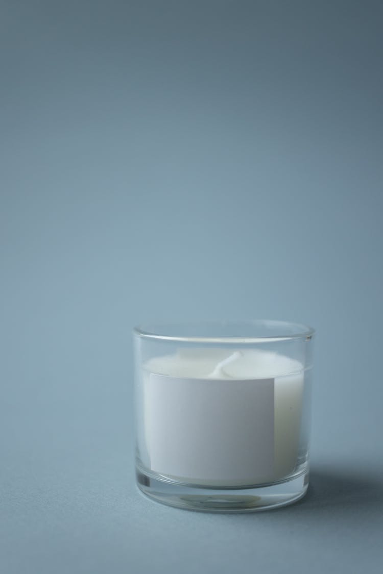 White Candle In Gray Background