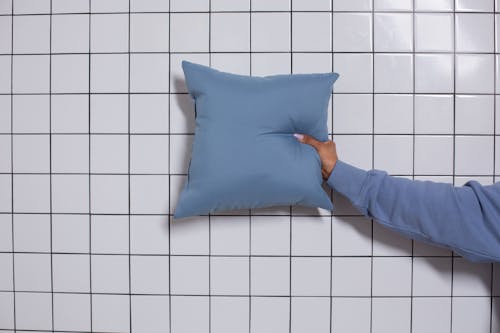 Person Holding a Throw Pillow