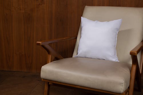 White Throw Pillow on a Chair