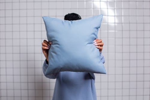 Person Holding a Throw Pillow  