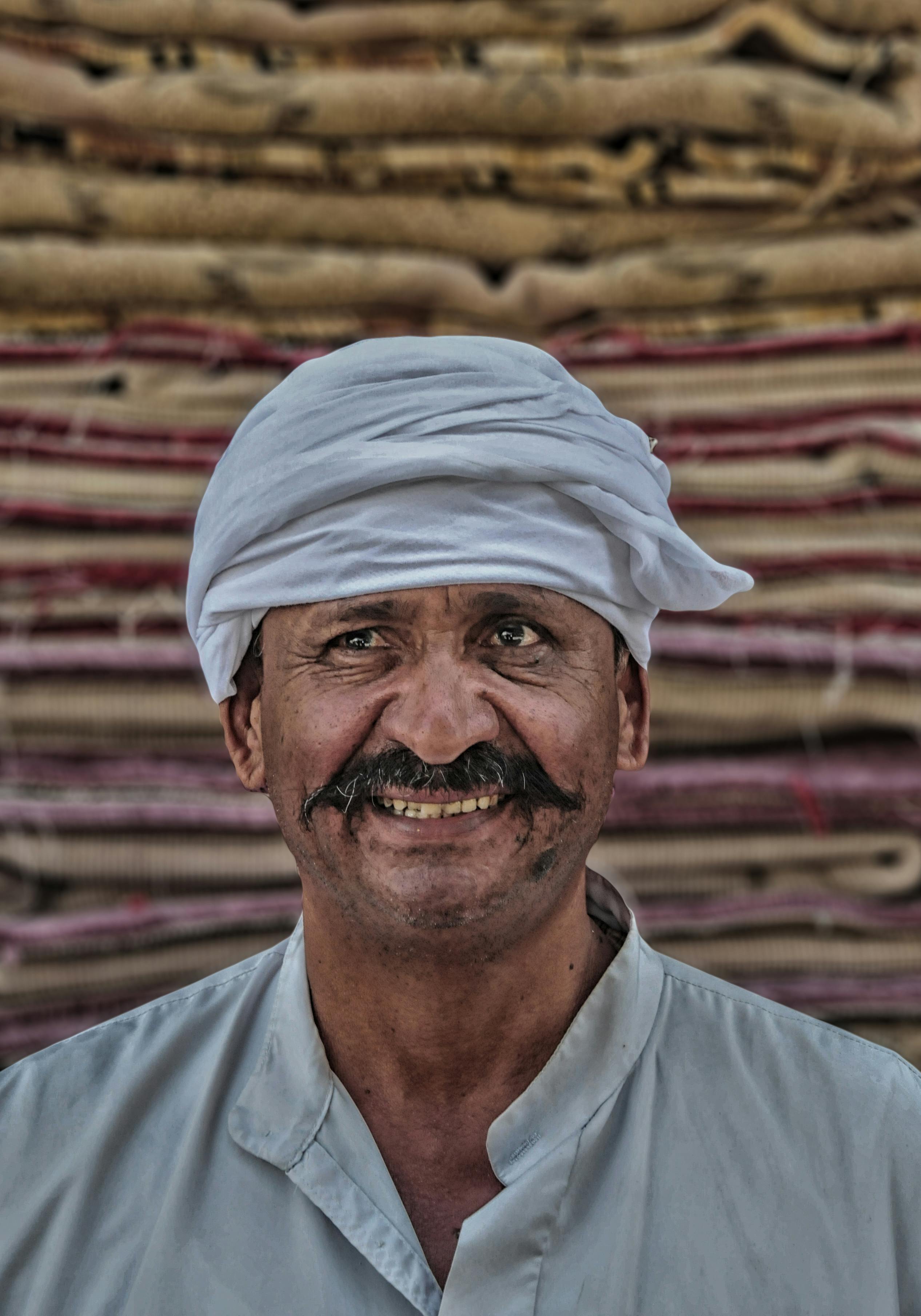 photo of a man in white buttoned up top