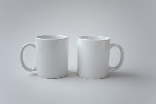 Plain White Mugs on a White Surface