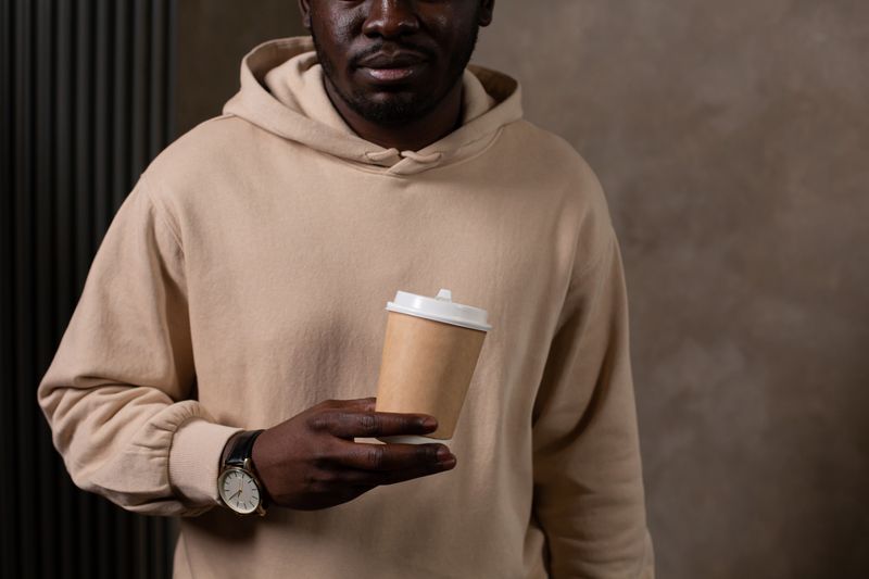 coffee cup with a clock in the background