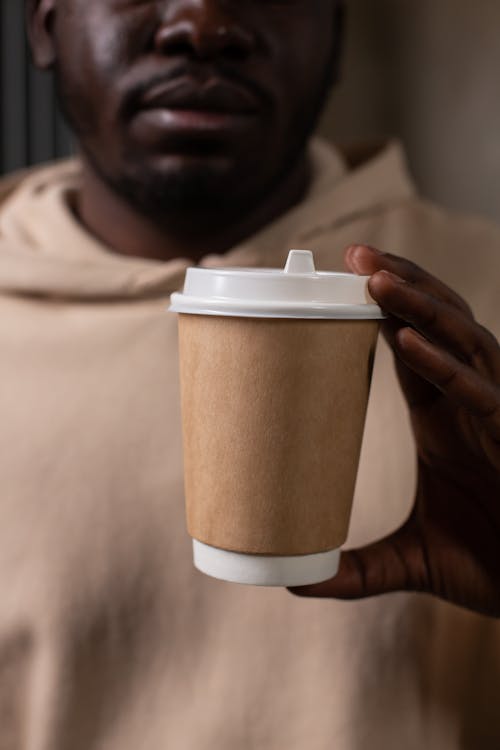 A Man Holding a Coffee Cup