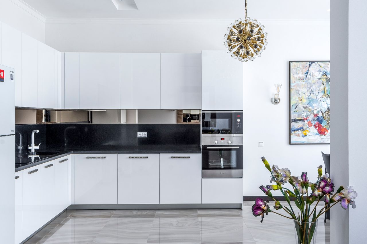 interior of stylish modern kitchen with necessary furniture and applia