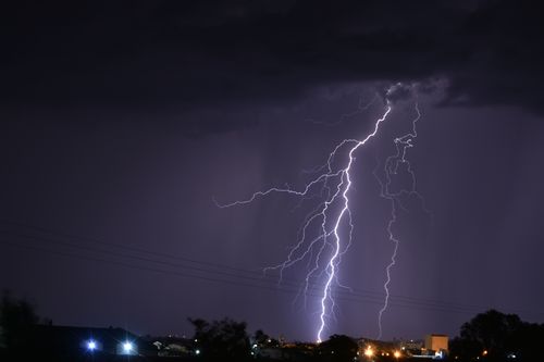 Free Powerful lightning strike illuminates the night over a South African landscape, showcasing nature's fierce beauty. Stock Photo