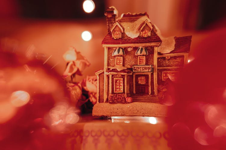 A House Figurine In Close-up Photography