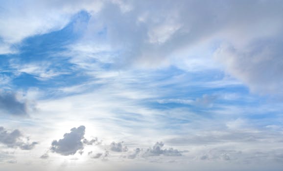 Tranquil blue and white cloudscape above Kapaa with light soft clouds.