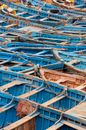 Typical wooden fishing boats moored in row