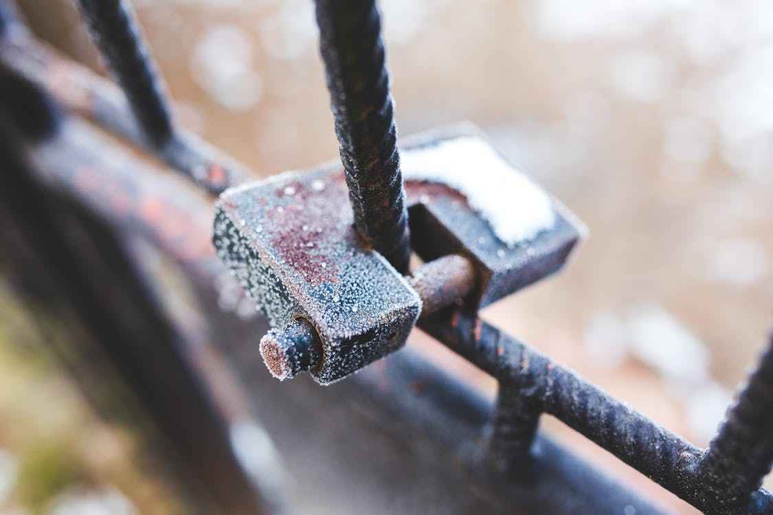 Free Rusty padlock covered with hoarfrost ice crystals Stock Photo