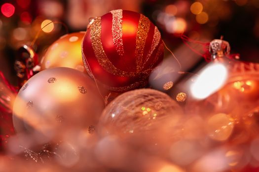 Close-up of colorful Christmas ornaments creating a festive and warm holiday ambiance.