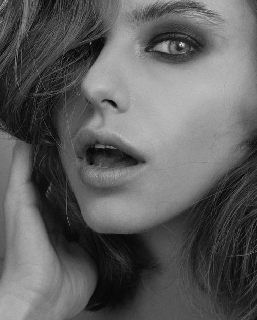 Free Elegant black and white portrait capturing a woman's surprised expression in Kyiv. Stock Photo