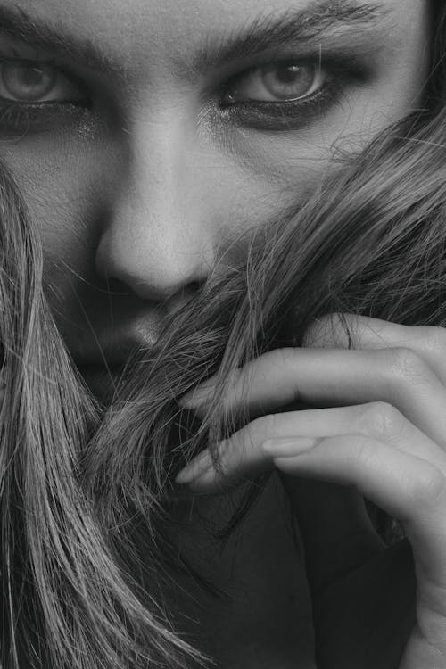 Extreme Close-up Shot of a Woman Seriously Looking at the Camera