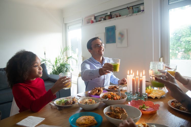 A Happy Family Eating Lunch Together