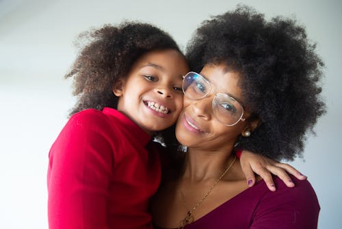 Free A Portrait of a Happy Mom and Daughter Stock Photo