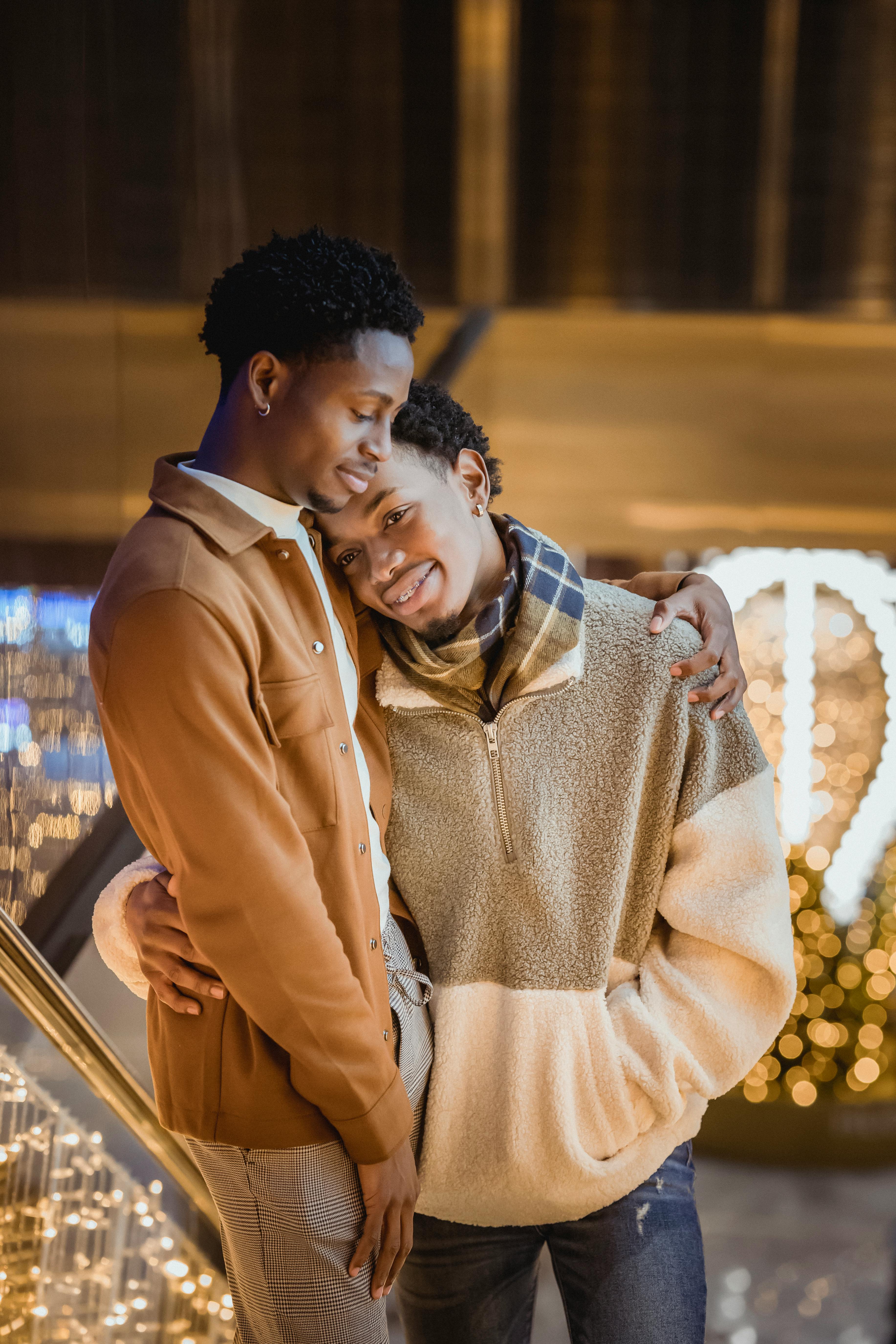 african american gay couple hugging each other