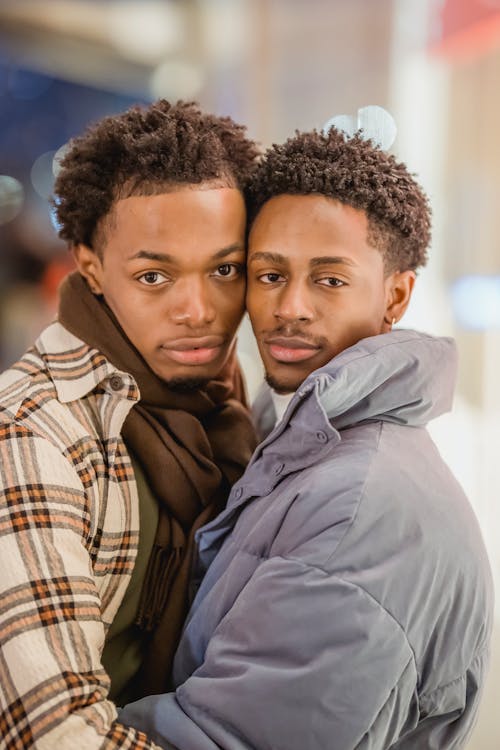 Romantic black gays hugging in city