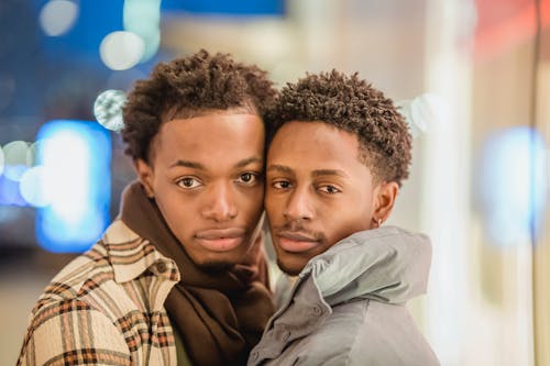 Content black gays standing in city