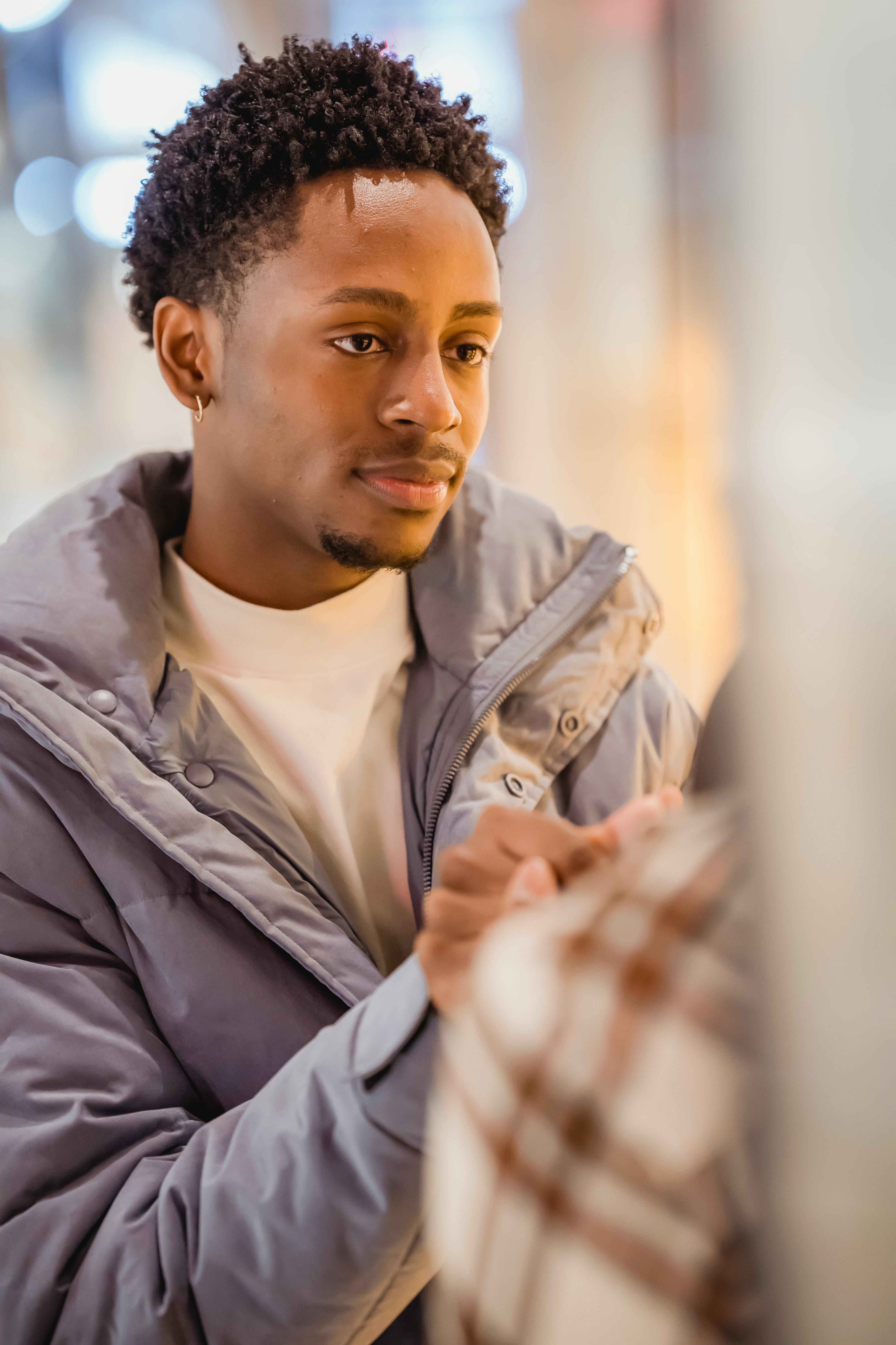 black man holding hands with friend