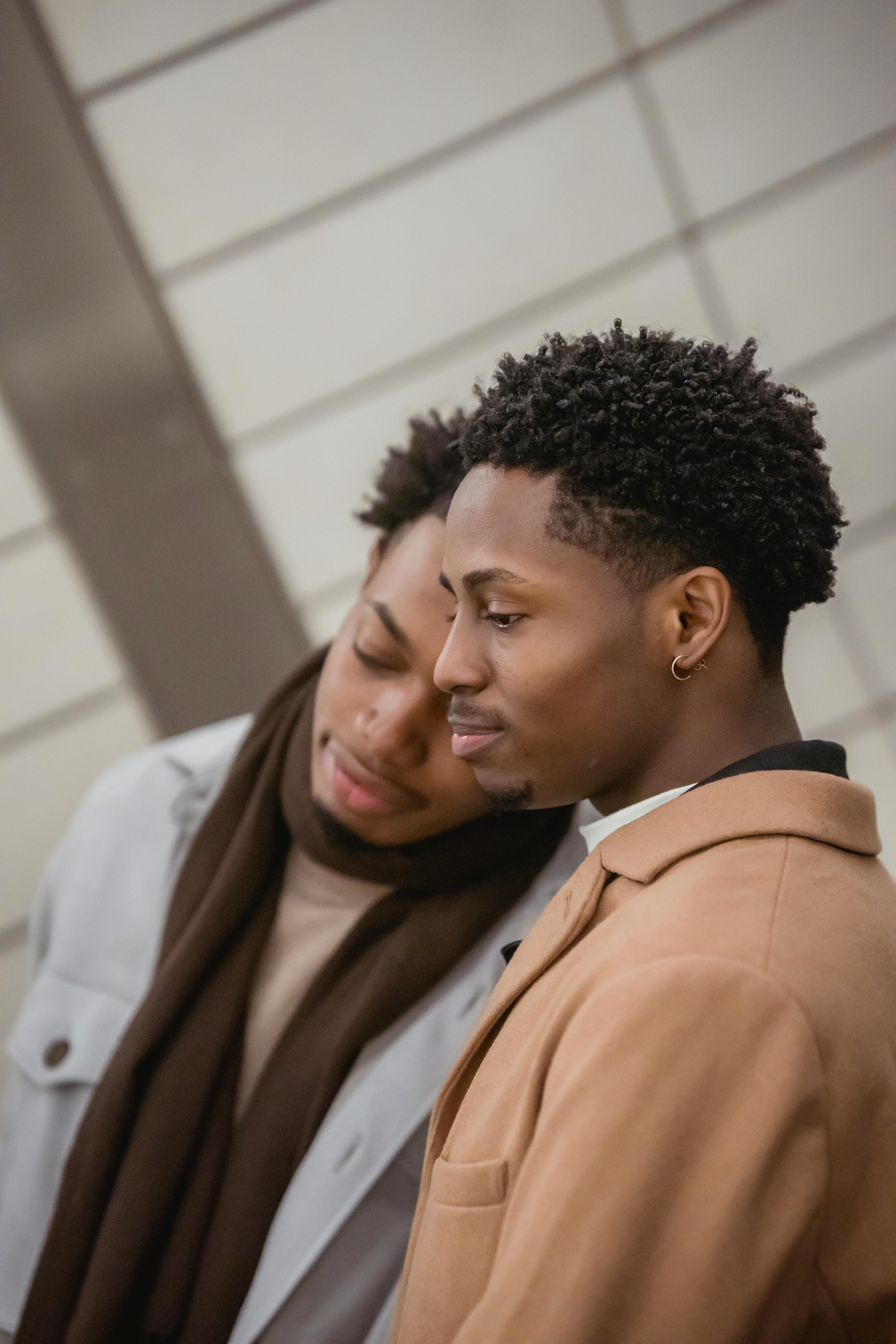 black same sex couple standing close