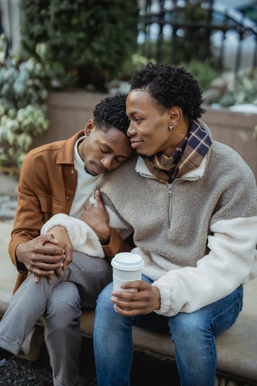 Free Romantic black gays with coffee on street Stock Photo