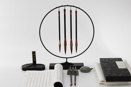 Ink Brushes Hanging from a Circular Frame