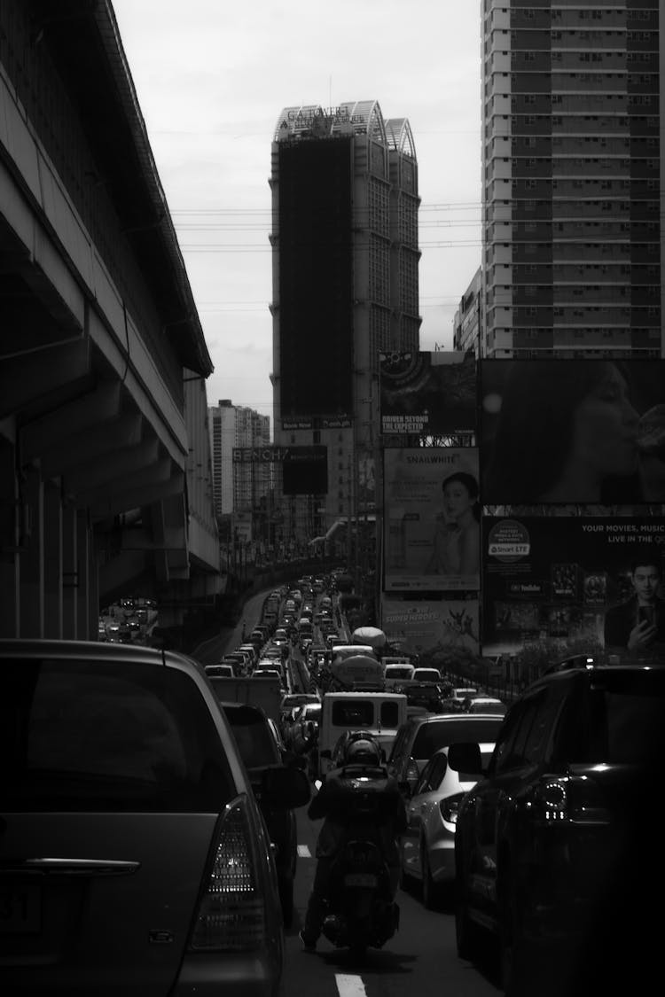 Grayscale Photo Of Traffic On A Road In Manila