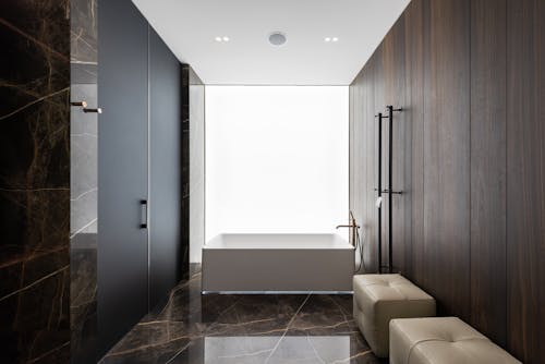 Free Spacious bathroom interior design with leather poufs Stock Photo