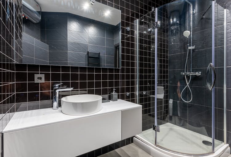 Sink And Shower Unit In Bathroom