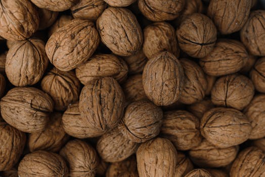A detailed close-up of organic unshelled walnuts, perfect for healthy eating themes.
