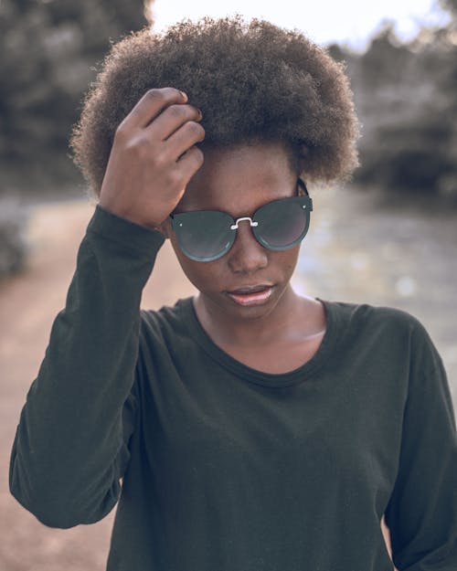 Woman with Afro Hair Wearing Sunglasses