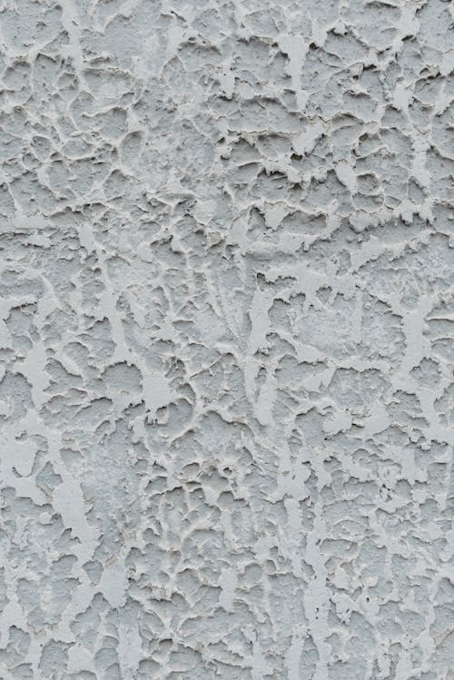 Abstract background of textured aged stucco wall