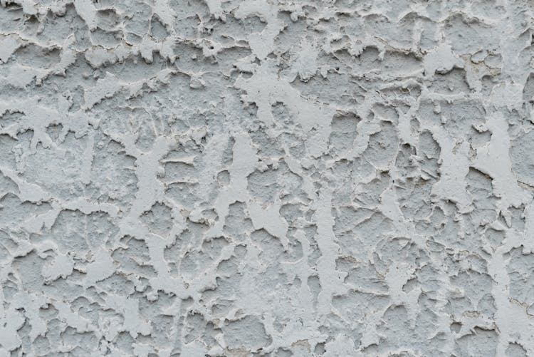 Cracked Gray Stucco Wall With Cracked Surface